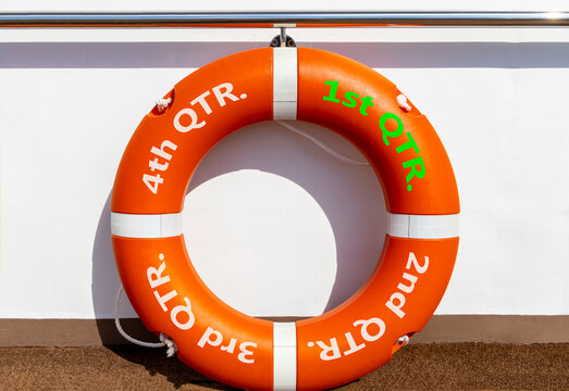 1st first quarter symbol. Beautiful orange lifebuoy with words 1st QTR. Beautiful white background. Business, happy 1st first quarter Q1 concept. Copy space.