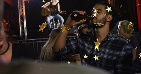 Guitarist strumming bar stage starting set, man sipping beer while socializing, gold stars drifting