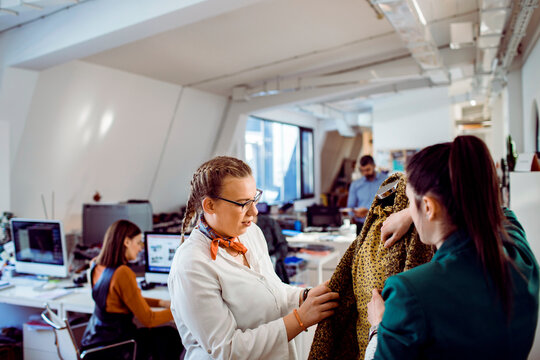 Young adults working in textile design office