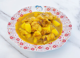 Indulge in the rich flavors of homemade chicken curry with tender potatoes. A comforting and satisfying dish, perfect for a cozy dinner or flavorful lunch. Enjoy the culinary delight!