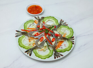 Experience the exotic flavors of Thai cuisine with this vibrant raw shrimp salad, a culinary delight that tantalizes taste buds. Perfect for food enthusiasts seeking unique dishes.