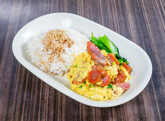 irresistible flavors of char siu pork with fluffy scrambled eggs and perfectly steamed rice, a visually appealing and satisfying meal.