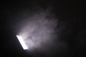 Professional lighting equipment without reflector and smoke on dark background. Space for text