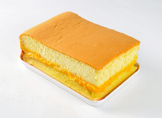 Experience pure bliss with this fluffy sponge cake, generously filled with a luscious creamy yellow center. Perfect for celebrations, desserts, or a delightful treat.