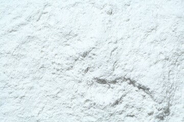 Texture of dry talcum powder as background, top view