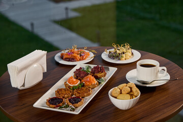An exquisite gourmet breakfast spread accompanied by delicious coffee and delightful treats