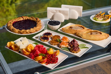 Enjoy a gourmet breakfast with delightful pastries and a variety of fresh, colorful fruits