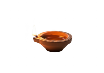 Clay diya lamp burning brightly with a gentle flame. Earthen diya lamp isolated on transparent background, a traditional source of light during diwali celebration