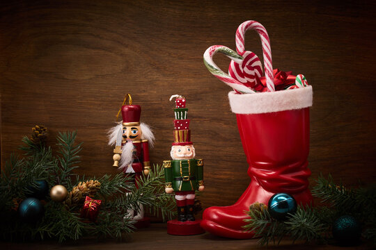 St. Nicholas Day. Red boot with sweets, spicy ginger cookies and gifts for December 6th