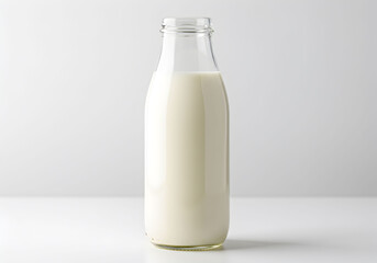 Glass Bottle of Milk on White Background