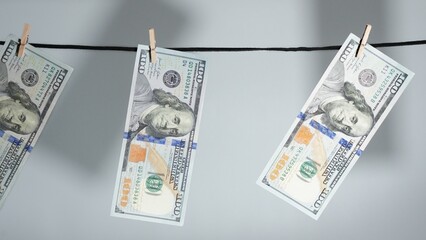 Currency Laundering Concept Freshly Printed Bills Drying on a Clothesline, Crime Metaphor