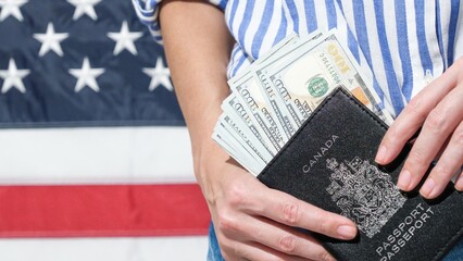 Canadian Passport and US Dollars with American Flag for Travel Preparations Planning