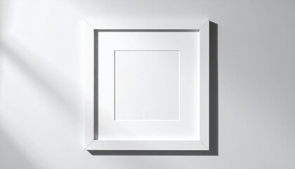 Minimalist white square frame on a light gray wall with soft shadows, emphasizing geometric simplicity and spatial depth.