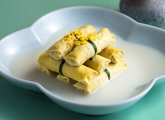 bean curd rolls, Braised dried tofu sheet, minced pork, chicken sauce a light and healthy dish. Perfect for showcasing innovative cuisine, Asian food, or promoting a balanced, gourmet lifestyle.