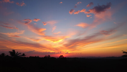 Colorful sunset sky glowing above wild jungle