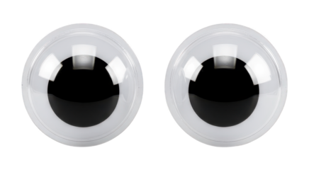 Two blank plastic googly eyes stare forward on black.