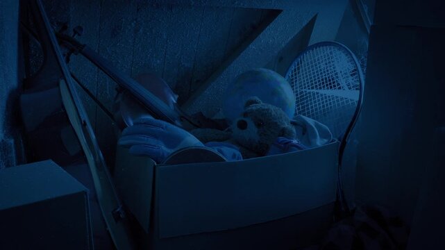 Box Of Childhood Items In Dark Attic