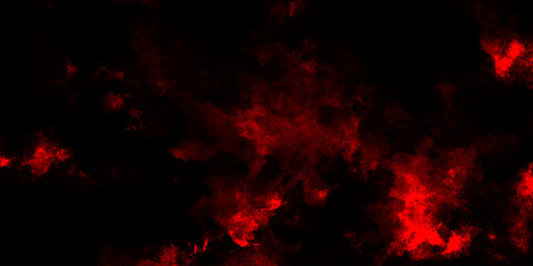 A dark dramatic background with intense red and black smoke-like clouds, creating a fiery, atmospheric effect. red grange powder explosion cloud on black background. red scary horror movie background.