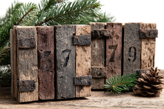 Rustic wooden blocks displaying numbers vintage style with pine cone and evergreen for holiday decor and seasonal display