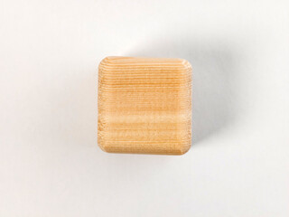 Natural wood block with grain texture isolated on a white background