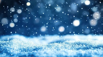 Beautiful blue background with soft falling snowflakes in winter season, sparkling snow and blurred background, perfect for seasonal and holiday themes