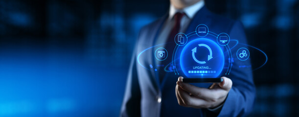 Businessman Holding Device with Update Icons on Screen. Software Updating or Upgrade Concept