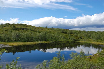 A picturesque lake in the Finnish tundra, Sami territory, amazing nature, Karelia, fantastic landscapes, fishing, tourism.