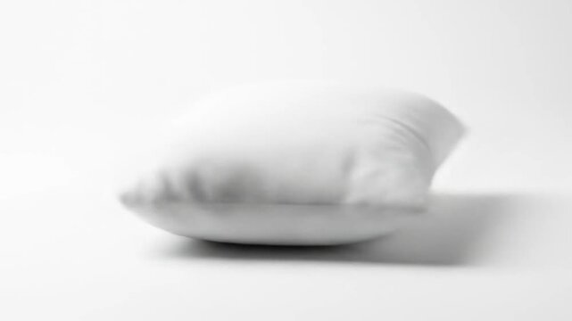 Soft, white rectangular pillow on white background