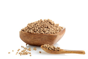closeup of bran bud cereal with a spoon in a wooden bowl