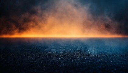 Dark asphalt road at night with orange and blue smoky clouds
