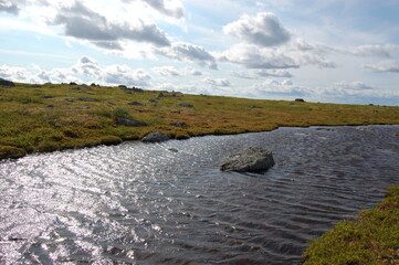 A picturesque lake in the Finnish tundra, Sami territory, amazing nature, Karelia, fantastic landscapes, fishing, tourism.