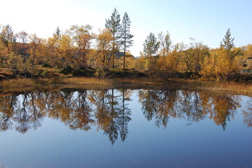 A picturesque lake in the Finnish tundra, Sami territory, amazing nature, Karelia, fantastic landscapes, fishing, tourism.