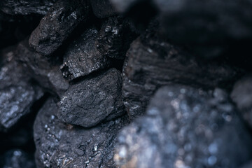 Close-up of raw black coal rocks with detailed texture and natural patterns