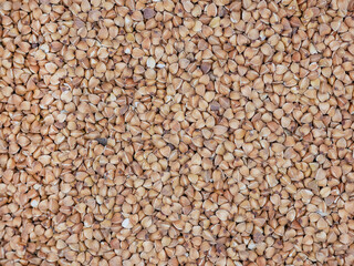 A close-up view of buckwheat. The textured abstract background