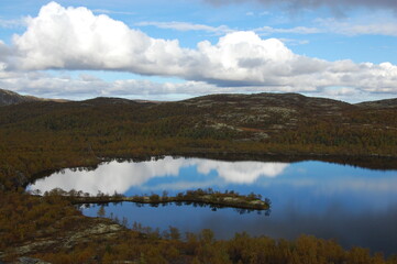 Fototapeta premium A picturesque lake in the Finnish tundra, Sami territory, amazing nature, Karelia, fantastic landscapes, fishing, tourism.