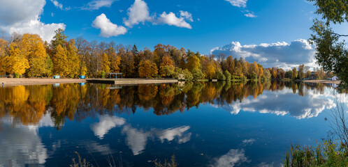 A colorful autumn panoramic landscape with Kolonistsky Pond in Otdelny Park. Pushkin, Saint...