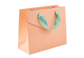 Peach-colored gift bag with light green ribbon handles isolated PNG, elegant packaging for presents and special occasions