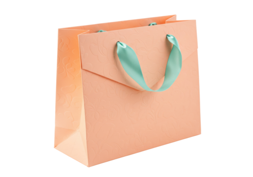 Peach-colored gift bag with light green ribbon handles isolated PNG, elegant packaging for presents and special occasions