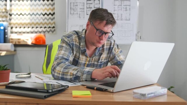 creative professional intensely designing, focused designer diligently working on digital drafting and sketches, creative professional concentrating intently on digital designs and detailed plans