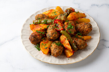 Traditional Homemade Turkish Food Kofte - Kofta with Tomato Sauce and Potatoes. (Turkish name; Izmir kofte)