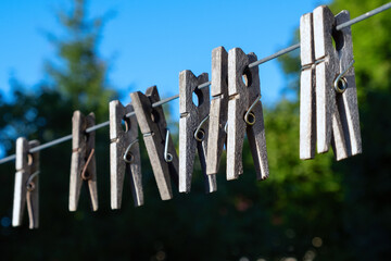 Wooden clothespins on a rope