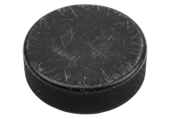 Worn black hockey puck isolated on white, sports equipment for ice hockey games and training sessions PNG
