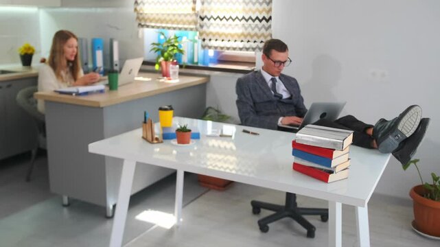 executive at desk with assistant, casual yet tense work environment with contrasting behaviors, an office setting depicting relaxed executive and attentive assistant amidst contrasting work attitudes
