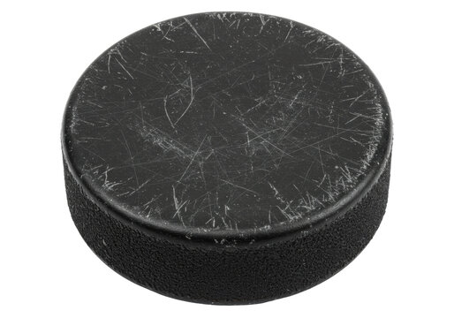 Worn black hockey puck isolated on white, sports equipment for ice hockey games and training sessions PNG