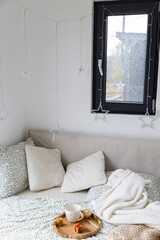 cozy bedroom detail and Christmas lights