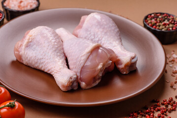 Raw chicken legs, poultry meat on the bone for barbecue. Chicken legs as a food background