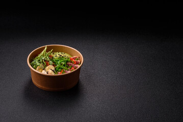 Seared tuna tataki in a bowl with sesame seeds, rice, and vegetables. Tuna tataki