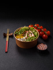 A prawn or shrimp bowl with rice, tomatoes, sauce, and vegetables, Asian food. Prawn or shrimp