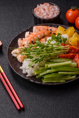 A prawn or shrimp bowl with rice, tomatoes, sauce, and vegetables, Asian food. Prawn or shrimp