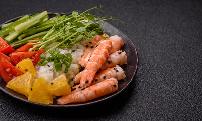 A prawn or shrimp bowl with rice, tomatoes, sauce, and vegetables, Asian food. Prawn or shrimp